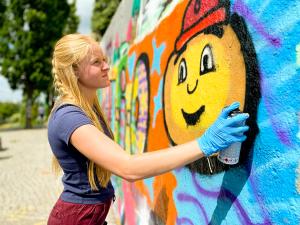 student spray painting