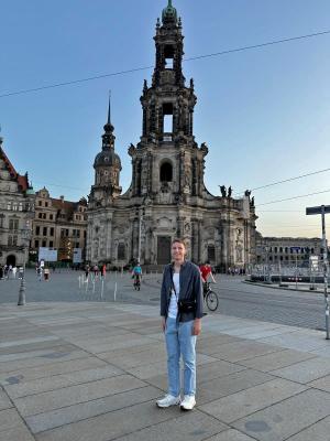 student in front of castle