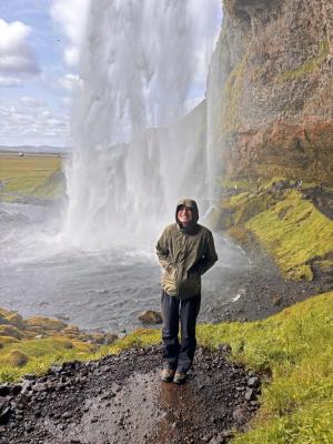 student near a waterfall