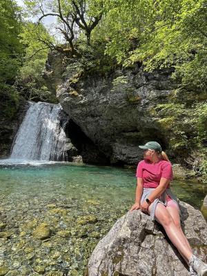 student looking at waterfall