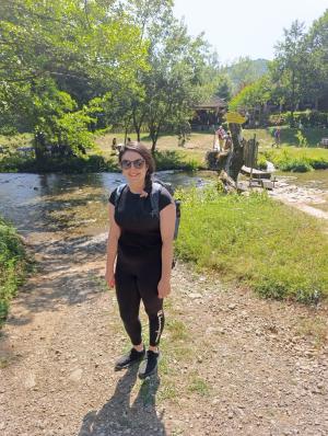 Woman in black standing