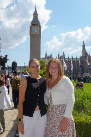 Two women smiling in front of Big Ben.