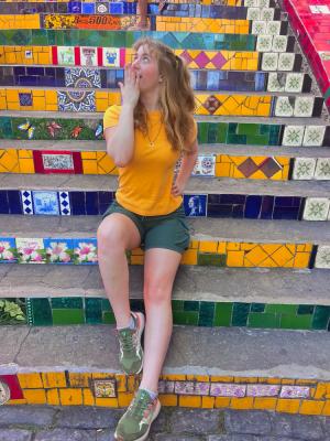 Woman sitting on colorful steps