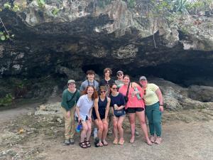 students near a cave