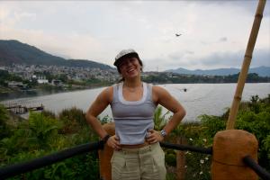 Student posing near a lake