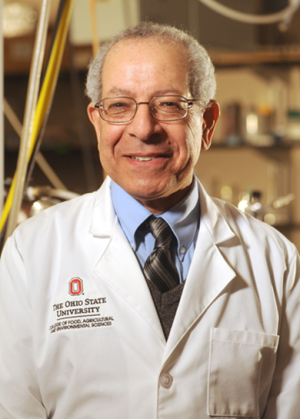 Male wearing glasses and a lab coat.