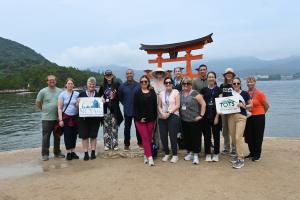 Group of people in front of body of water in Japan