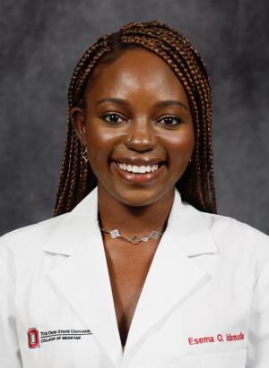 Female portrait wearing a white lab coat.