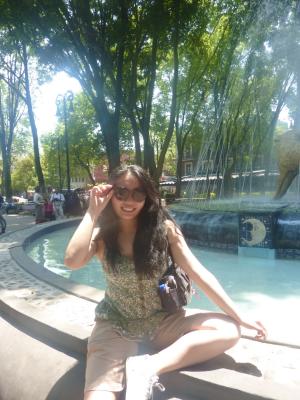 Student posing near a pool