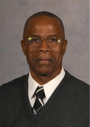 Male wearing glasses and tie