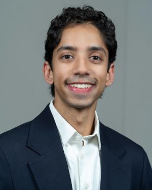 Male portrait wearing suit jacket and white shirt