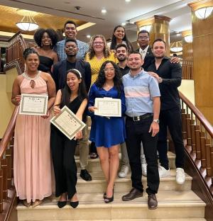 Students from Miami University posing for a photo on stairs.