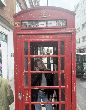 student in a phone booth