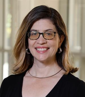 Female wearing glasses headshot.